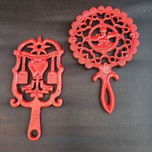 Cast Iron Dumb Dutch Girl in Bonnet Footed Trivets Red Enamel Set of 2 VTG Wall
